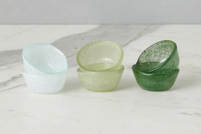 The ETUHOME Glass Pinch Pots Set of 6 features small, textured green glass bowls—handcrafted in Turkey—in translucent white, light green, and dark green shades, displayed side by side on a white background.