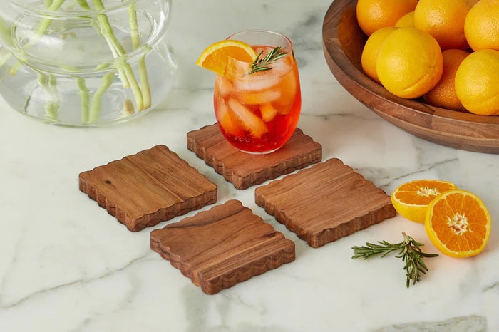 The ETUHOME Scalloped Wood Coasters, Set of 4, features square coasters with wavy scalloped edges, neatly stacked atop each other against a white background.