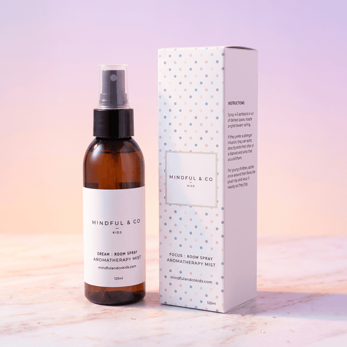 Brown bottle and white box of Mindful & Co Aromatherapy Mist on a light background