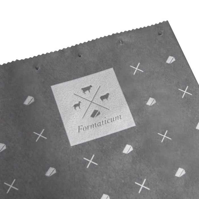 A box of FORMATICUM - REUSABLE CHEESE STORAGE BAGS by FORMATICUM features a white and black design, “Reduce cheese waste” and “Keeps cheese fresher, longer” text, and contains 10 reusable bags.