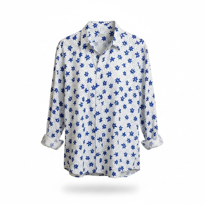 A man with short gray hair and a beard wears the FRANK & EILEEN Finbar Men's Button Up Shirt in Blue and White Small Flowers Big Flowers. He pairs it with dark jeans, standing against a plain white background for an everyday look.