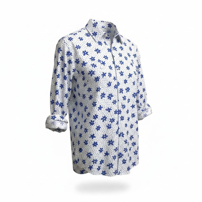 A man with short gray hair and a beard wears the FRANK & EILEEN Finbar Men's Button Up Shirt in Blue and White Small Flowers Big Flowers. He pairs it with dark jeans, standing against a plain white background for an everyday look.