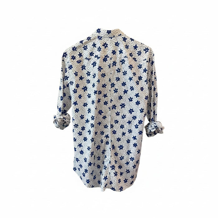 A man with short gray hair and a beard wears the FRANK & EILEEN Finbar Men's Button Up Shirt in Blue and White Small Flowers Big Flowers. He pairs it with dark jeans, standing against a plain white background for an everyday look.