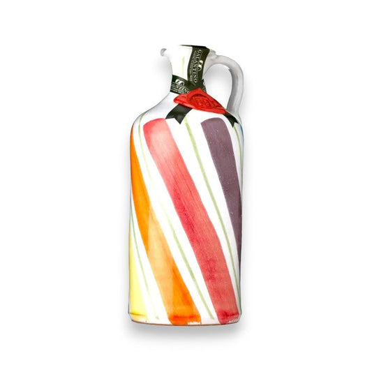 The GALANTINO - RAINBOW WAVES EXTRA VIRGIN OLIVE OIL by ZIA PIA IMPORTS comes in a ceramic bottle with a handle, featuring orange, yellow, red, and purple stripes on white, plus a wax seal and green neck label.