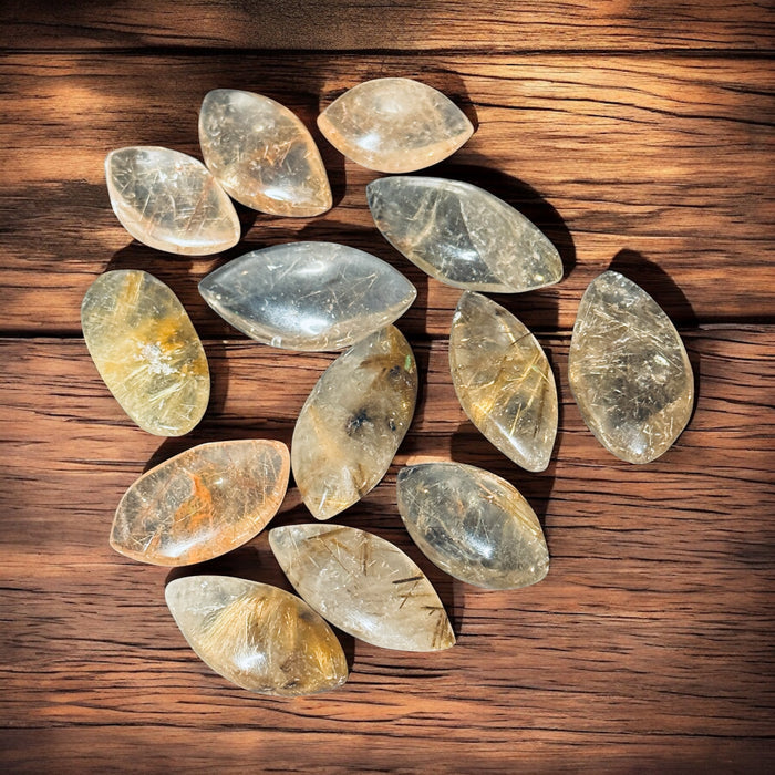 Golden Rutilated Quartz marquis palm stone – 5–10 grams, Raven’s Cauldron, 6 N Sandusky St, Delaware, OH 43015