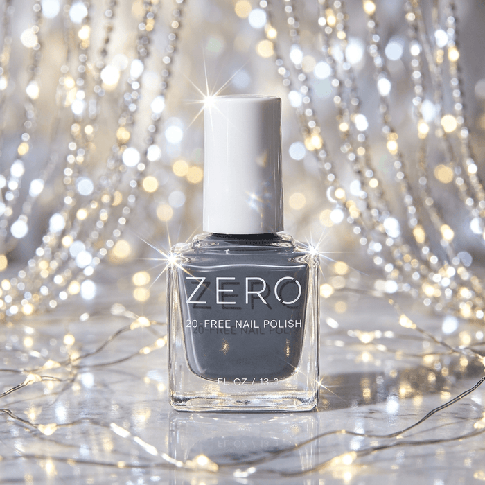 Bottle of ZERO nail polish on a glittery background