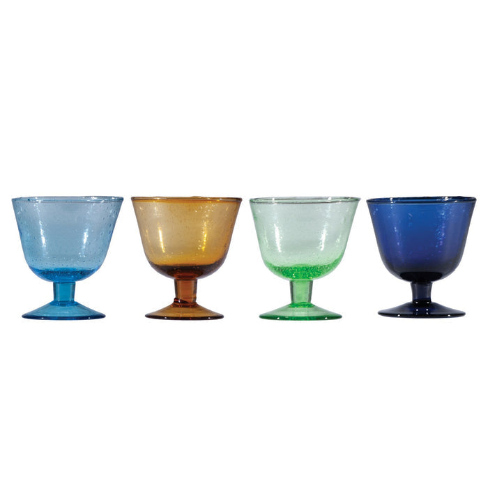 The HAND-BLOWN STEMMED SEEDED GLASS by CREATIVE COOP is a green-tinted goblet with a wide bowl, short stem, and round base. Its hand-blown seeded glass features visible bubbles and a gradient with richer green at the bottom.