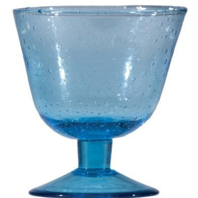 Four CREATIVE COOP HAND-BLOWN STEMMED SEEDED GLASSES in blue, amber, light green, and dark blue are displayed side by side on a white background, highlighting the charm of traditional glassmaking.