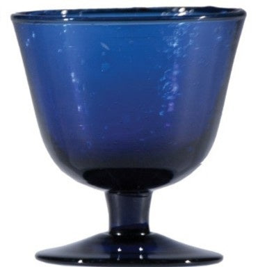The HAND-BLOWN STEMMED SEEDED GLASS by CREATIVE COOP is a green-tinted goblet with a wide bowl, short stem, and round base. Its hand-blown seeded glass features visible bubbles and a gradient with richer green at the bottom.
