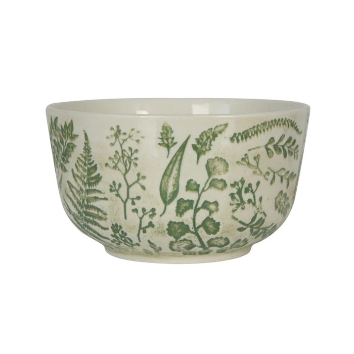 The HAND-STAMPED STONEWARE BOWL WITH BOTANICAL PATTERN by CREATIVE COOP features green leaf and fern illustrations encircling its white ceramic exterior, offering an artisan-inspired look.