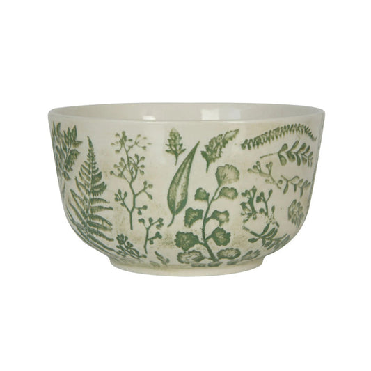 The HAND-STAMPED STONEWARE BOWL WITH BOTANICAL PATTERN by CREATIVE COOP features green leaf and fern illustrations encircling its white ceramic exterior, offering an artisan-inspired look.