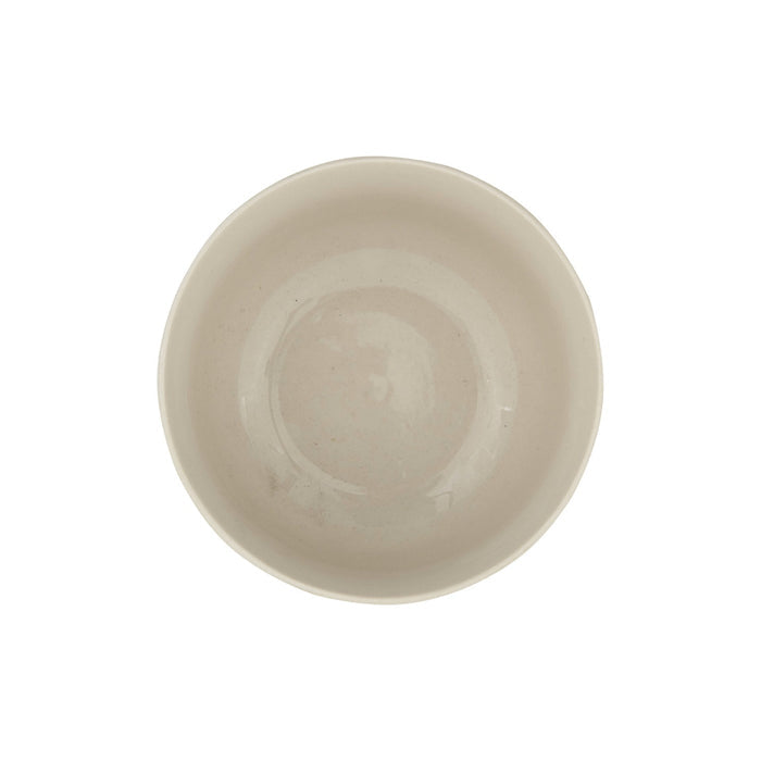 The HAND-STAMPED STONEWARE BOWL WITH BOTANICAL PATTERN by CREATIVE COOP features green leaf and fern illustrations encircling its white ceramic exterior, offering an artisan-inspired look.