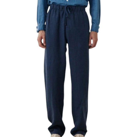HARTFORD Linen Joggy Pants in Navy feature an elastic waistband, drawstring, side pockets, and a relaxed fit. Crafted from breathable linen by HARTFORD, these joggers are showcased on a plain background.
