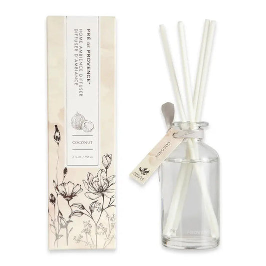 The HERITAGE REED DIFFUSER - COCONUT by EUROPEAN SOAPS, LLC features a coconut scent with white reeds in a floral box. Made in France, it brings an elegant touch to any space.