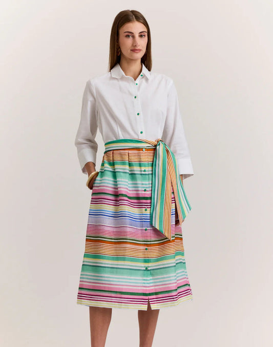 A woman wears the HINSON WU Robin 3/4 Sleeve Linen Dress in Multi Stripe, featuring breathable fabric and a matching tie belt, standing against a plain light background.