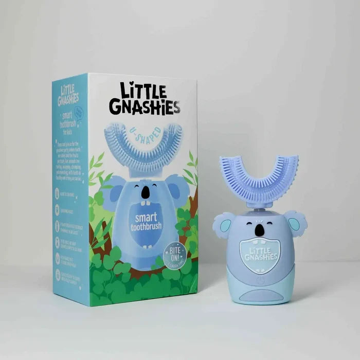 Little Gnashies smart toothbrush with packaging on a white background