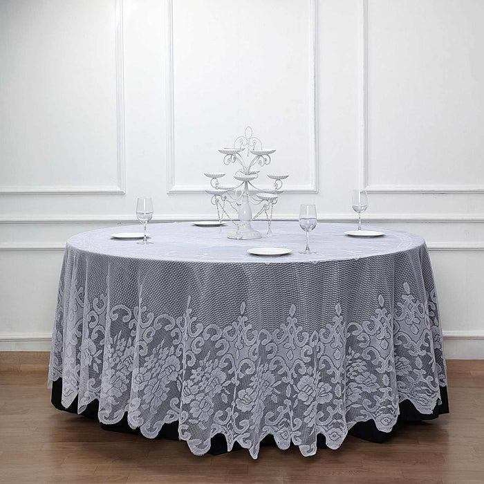 Elegant white lace tablecloth draping a round table in a sophisticated setting.