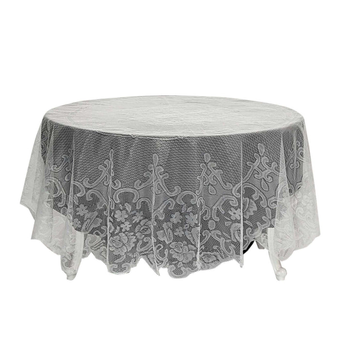 Round lace tablecloth with floral design on a white backdrop.