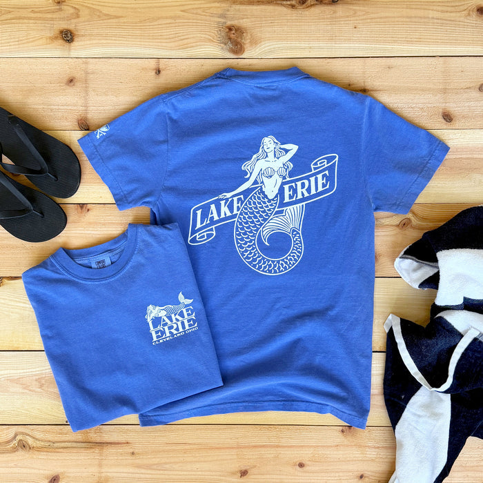 Blue t-shirt with mermaid graphic and 'Lake Erie' text on a wooden surface