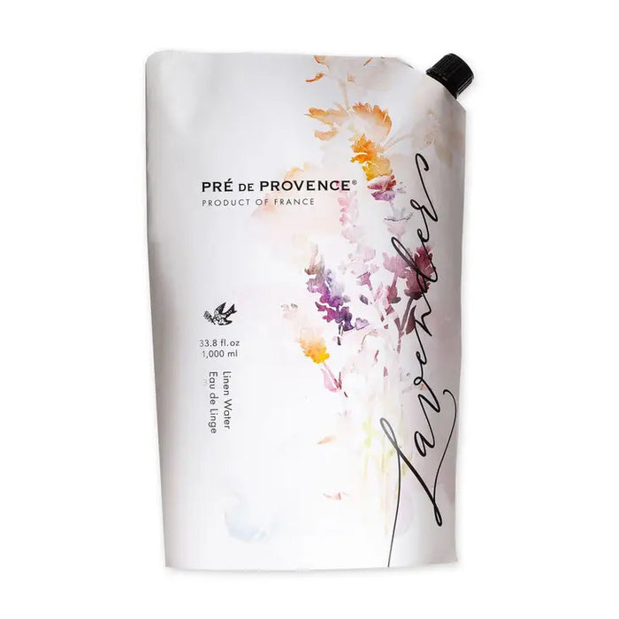A white refill pouch of EUROPEAN SOAPS, LLC LAVENDER LINEN WATER REFILL features watercolor floral designs and “Lavender” script on front. Its soothing scent is ideal for misters or steam iron use. Black spout located at top right.