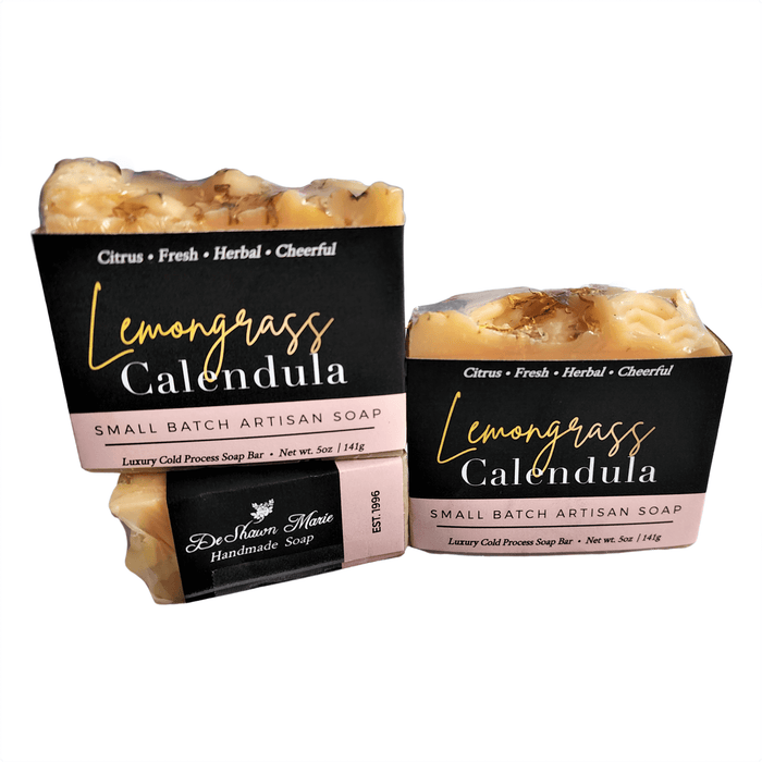 Lemongrass Calendula Soap Bar - Soap Boutique displayed alongside artisan soaps with fresh ingredients.