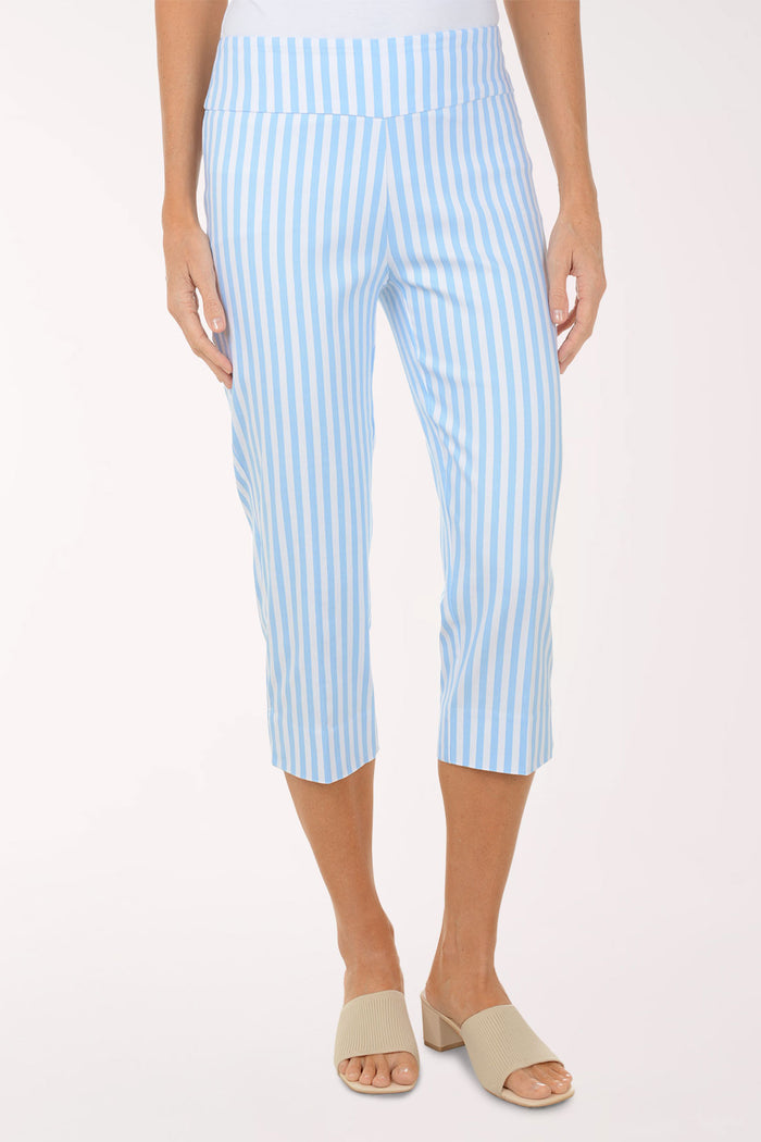 Person wearing light blue and white striped pants on a white background