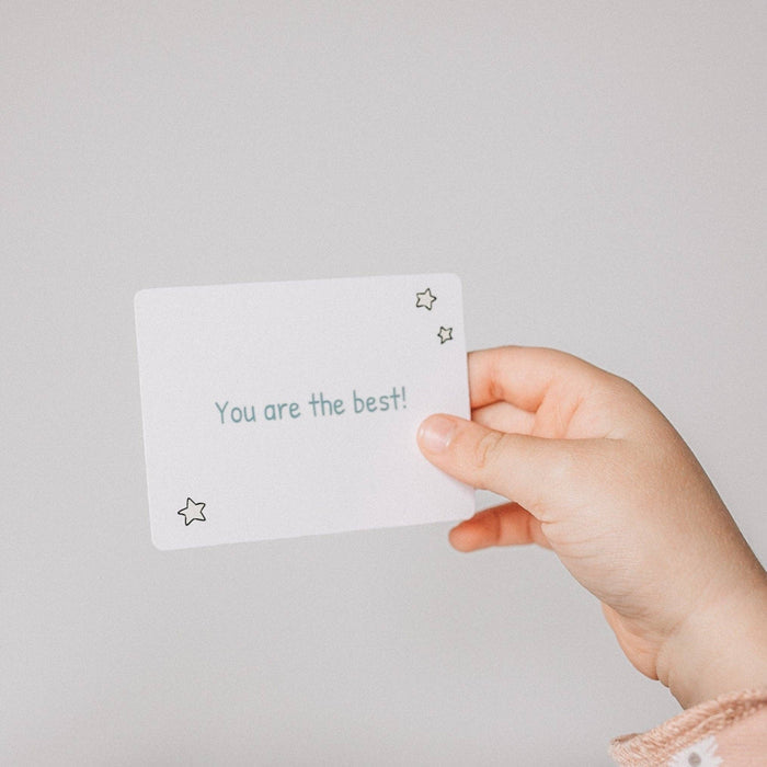 Child holding a Love Notes - Mindful and Co Kids affirmation card that says 'You are the best!'
