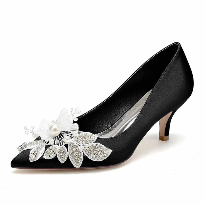 Elegant black heels with pearl embellished wedding shoes and decorative floral accents
