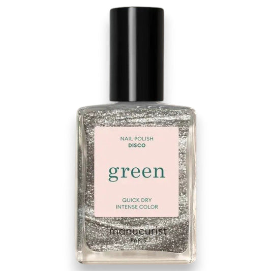 A transparent glass bottle of MANUCURIST - GREEN™ Nail Polish in Disco by MANUCURIST INC contains a sparkling silver glitter vegan polish. The bottle features a black cap and a white label adorned with green and black text.