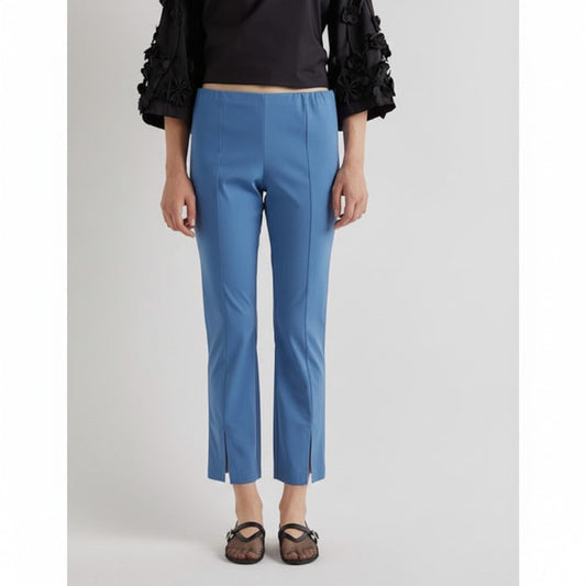 A solid bright blue background, echoing the vivid shade of the MEIMEIJ Front Hem Slit Pant in Jasper from MEIMEIJ, with no visible patterns, objects, or text.