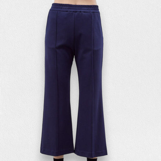 A person wears MEIMEIJ Pull-On Straight Leg Cropped Pants—black, high-waisted with an elastic waistband and subtle front seam—standing against a plain white background.