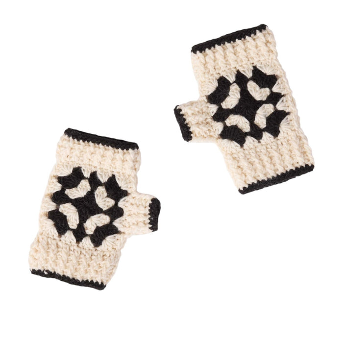 The MERSEA - LA PAZ CROCHET FINGERLESS GLOVES by MERSEA, cream-colored with black borders and a central black geometric pattern, are displayed on a white background.