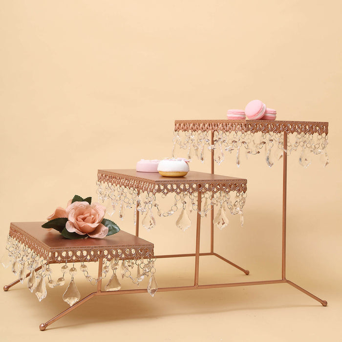 Decorative tiered display stand with floral accents and crystal embellishments.