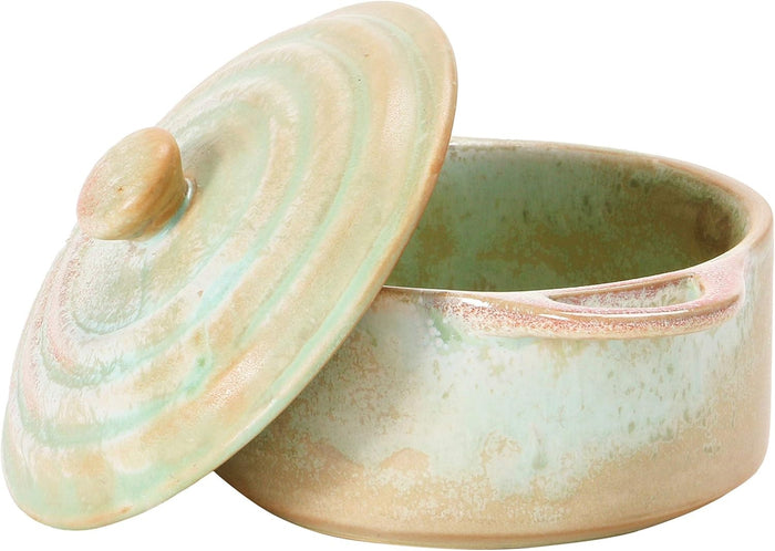 Introducing the MINI STONEWARE BAKER WITH LID by CREATIVE COOP—a rustic, round ceramic pot with side handles and a matching lid. Crafted in striking blue-green and brown hues, this mini baker features a reactive crackle glaze for distinctive texture. The lid is topped with an easy-to-grip knob handle, making it ideal for serving individual casseroles in style.