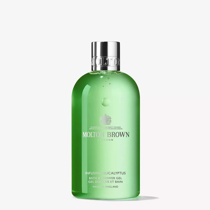 A green bottle of MOLTON BROWN - EUCALYPTUS BATH AND SHOWER GEL with a silver cap stands upright against a white background, displaying the aromatic product label on the front.