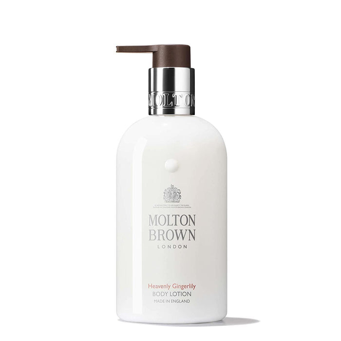 A white bottle of MOLTON BROWN - HEAVENLY GINGERLILY BODY LOTION with a silver collar and dark brown pump, featuring notes of ginger and cardamom, is displayed against a plain white background.