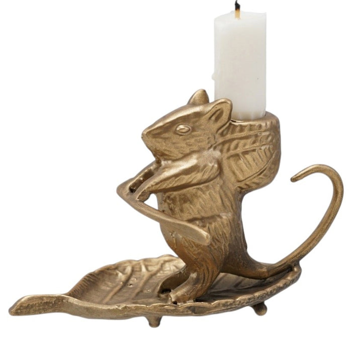 The CREATIVE COOP MOUSE ON LEAF CAST METAL TAPER HOLDER features an antique gold finish, measures 6"L x 3.25"H, and has a curled tail while sitting on a leaf-shaped base. Shown on a white background.