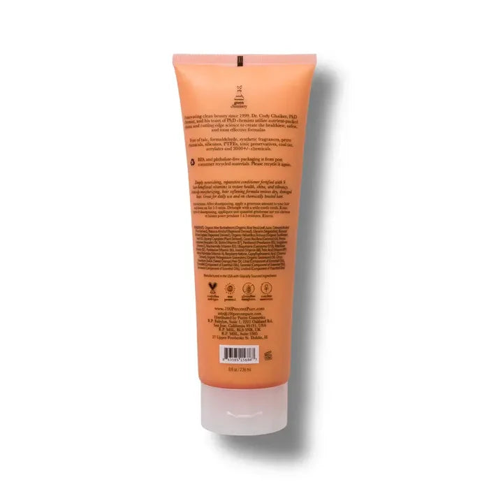 Back view of a peach-colored tube with text and a barcode on a white background