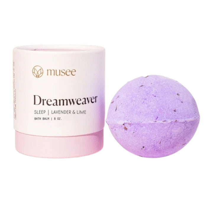 Instructional graphic with text on how to use the MUSEE - DREAMWEAVER THERAPY BATH BALM by MUSEE, featuring a dissolving colorful bath balm in pink bubbly water within a white flower outline on a pink background.