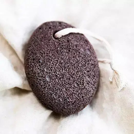Brown textured sponge on a white fabric background