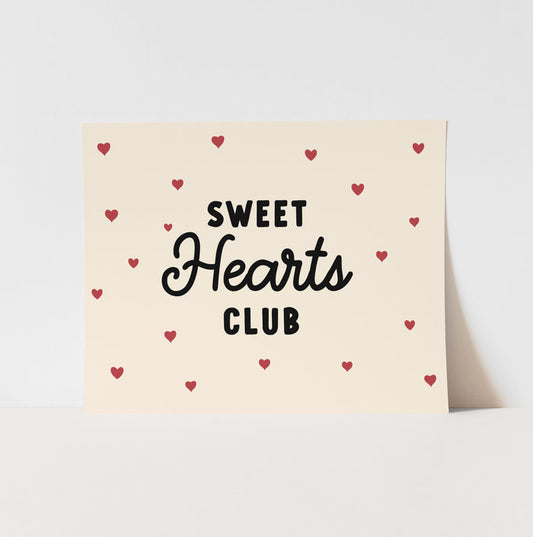 Card with 'Sweet Hearts Club' text and red hearts on a beige background