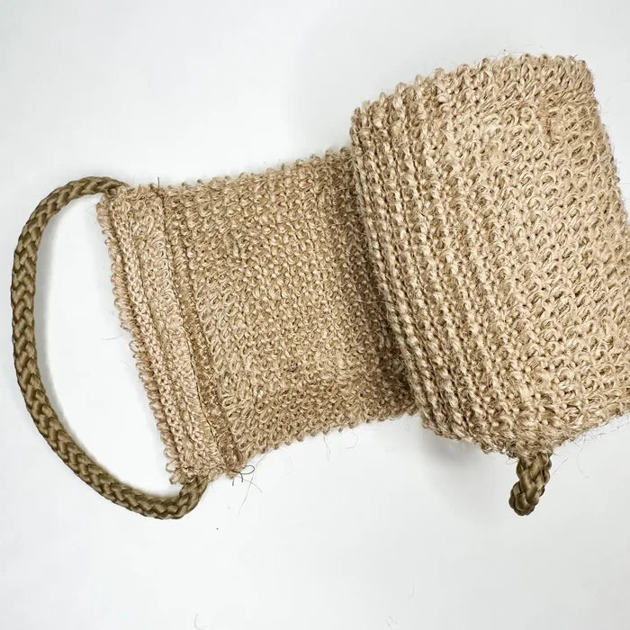 Beige woven bag with a strap on a white background