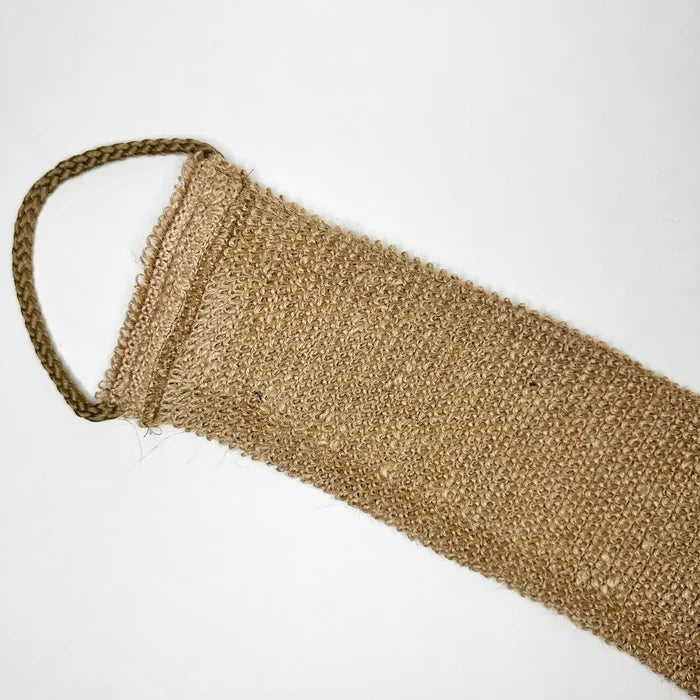 Brown textured bath sponge on a white background