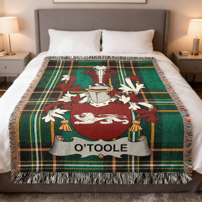 O'Toole Irish family crest woven blanket displayed on a bed.