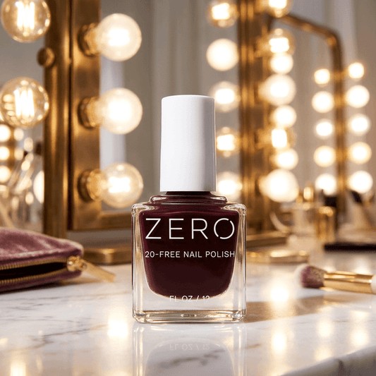 Bottle of Zero 20-Free Nail Polish on a vanity table with lights in the background