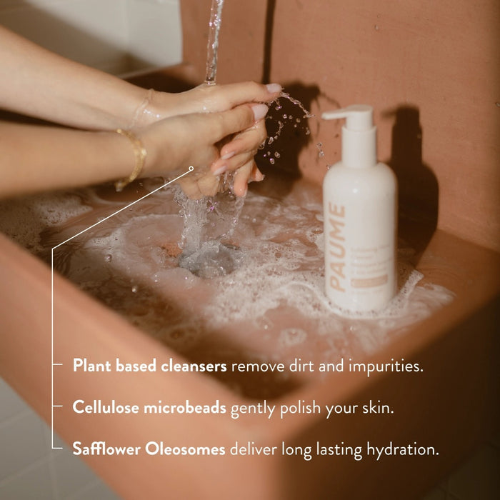 A bottle of PAUME - EXFOLITAING HAND SOAP, a moisturizing hand wash with pump, is displayed against a light beige background. The label shows tan and peach text with the product name and description.