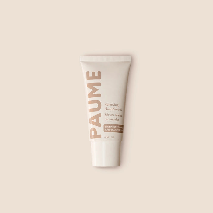 PAUME - RENEWING HAND SERUM by PAUME features beige and light brown text on a neutral background. This minimalist vitamin C serum targets hand hyperpigmentation and supports youthful-looking skin, with labels in English and French.