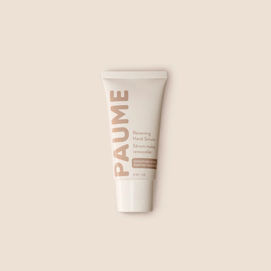PAUME - RENEWING HAND SERUM by PAUME features beige and light brown text on a neutral background. This minimalist vitamin C serum targets hand hyperpigmentation and supports youthful-looking skin, with labels in English and French.