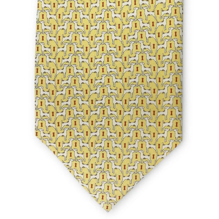 The BIRD DOG BAY PETER-BLAIR Jack Russell printed silk tie in yellow features a repeating dog motif and is handmade in New York.