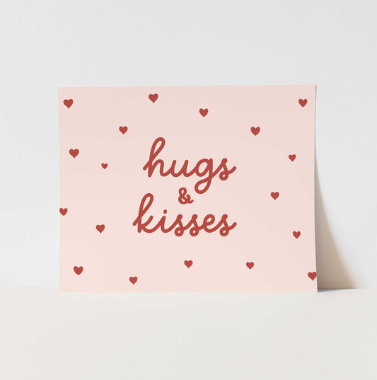 Card with 'hugs & kisses' text and heart patterns on a light pink background